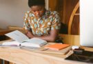 photo of woman reading books